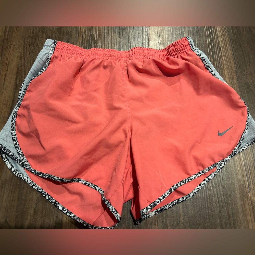 Coral Nike running shorts